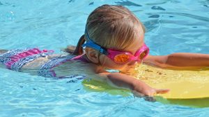 Child swimming in pool